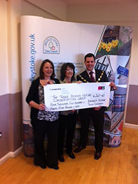 Ben Walker presenting a cheque to Three Brooks Nature Conservation Group