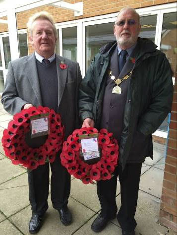Councillor John Ashe and the Town Mayor, Councillor Roger Avenin; with wreathes to be laid at the Service. Photograph courtesy of Councillor Franklin Owusu-Antwi.